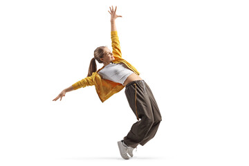 Teen girl dancing on tiptoes, hip hop style concept