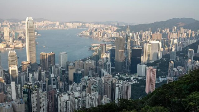 City Time lapse of Hong Kong. Timelapse of Hong Kong City and skyscrapers at sunset from The Victoria Peak high mountaintop vantage point. The Beautiful cityscape.