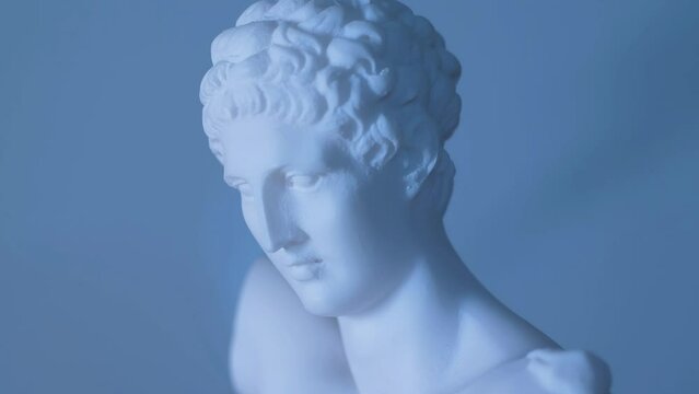 Rotating statue of the Greek God Apollo in warm light