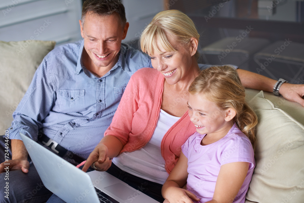 Sticker Family, laptop and parents with daughter on sofa in living room of home for entertainment streaming. Love, smile or happy with mother, father and girl children watching video on computer in apartment