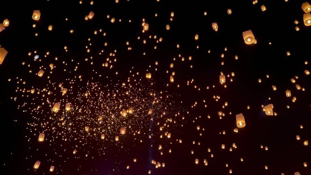 Flying lanterns in night sky in Loy Krathong festival, Chiangmai, Thailand