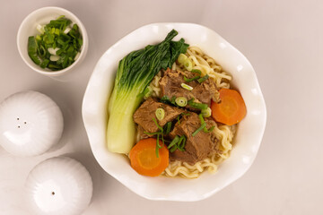 Taiwanese Beef Noodle Soup with Bok Choy and Carrot.