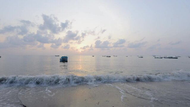 Timelapse Of Fisher Man Boat Move On The Beach. Small fishing boat at the sea with sunset background