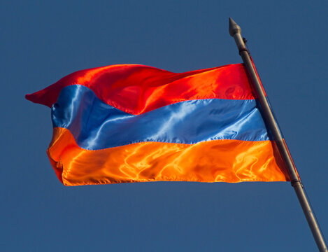 Armenian flag against the blue sky