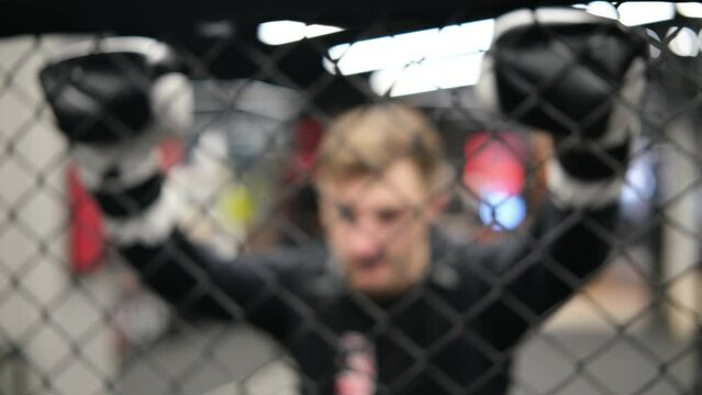 Close-up of athlete getting ready for fight. Man preparing. Sport concept in 4K.
