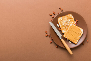 Peanut butter sandwiches or toasts on light table background.Breakfast. Vegetarian food. American...