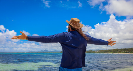 Man Standing on Boat in the Ocean