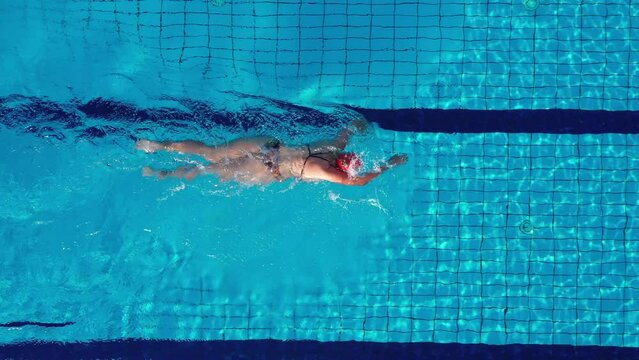 A woman Swimming in a Swimming Pool