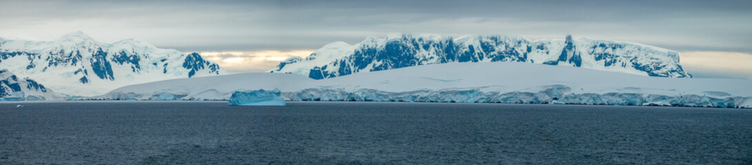 Paroramic scenery along the shores of Paradise Bay during the sothern summer solstice, Gerlach Straight, Antarctica.