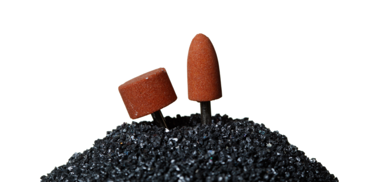 Silicon Carbide show with sharpening tools device. Black Silicon Carbide pile and top with spinning tools to sharpening surface material, White background Isolated particle element object