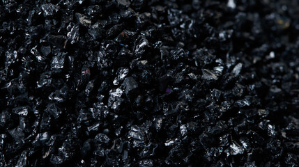 Macro close up of Silicon Carbide black sand size. Fine particle silicon carbide pile up, White...