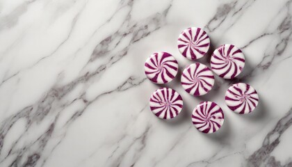 Obraz na płótnie Canvas round peppermint candies on white marble surface