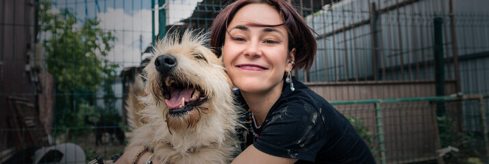 Obraz premium Dog at the shelter. Animal shelter volunteer takes care of dogs..