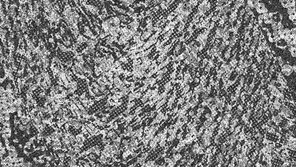 An abstract black and white halftone grunge texture background image.