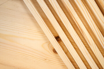 Wooden blocks lie diagonally. Background with copy space. Environmentally friendly building materials.