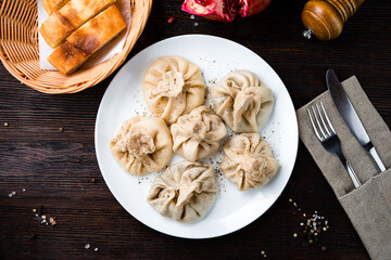 Tasty manti with meat, pepper and bread.