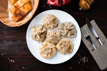 Georgian khinkali with meat, pepper and bread.