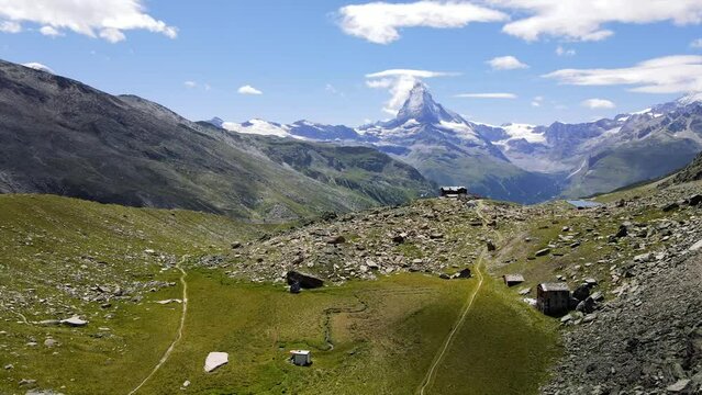 panoramic scenery featuring the Matterhorn and iconic Mountain Hut of Fluhalp  in Zermatt in the alps of Switzerland 