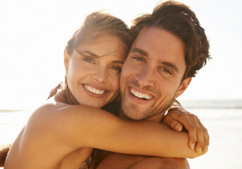 Happy couple, portrait and hug on beach for embrace, love or support in care on holiday or outdoor...