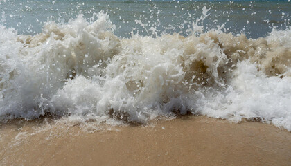  hard wave water hit sand in close up at beach