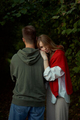 Fototapeta premium young teen couple hug and play in park
