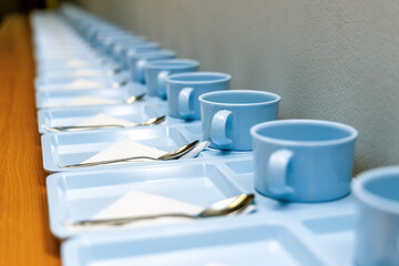 Coffee cups with spoon prepared for coffee break for participant at a meeting or seminar audience...