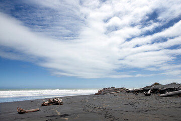 Fototapeta na wymiar S.S. Waitangi shipwreck. Rusty shipwreck at Mana Bay New Zealand. Patea. Taranaki. Tasman Sea. Coast and Beach. Lava sand.