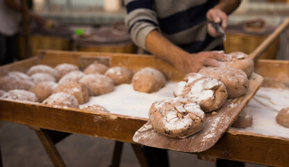Yeast dough in the form of loaves waiting to be cooked