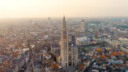 Papier Peint photo autocollant Anvers Antwerp, Belgium - July 21, 2023: Spire with the clock of the Cathedral of Our Lady (Antwerp). City Antwerp is located on river Scheldt (Escaut). Summer morning, Aerial View