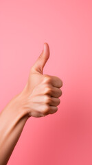 Thumbs Up Gesture, Hand Signaling Approval and Positivity, on Pink Background