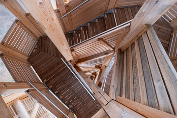 Spiraling wooden tower stairs. Top view, no people