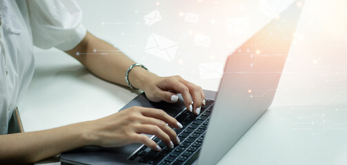 Hand of businesswoman using computer laptop with Email marketing and newsletter concept. Contact us by newsletter email and protect your personal information from spam mail concept. - obrazy, fototapety, plakaty