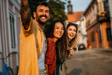 Three buddies enjoying a day out in the vibrant city, sharing smiles and stories