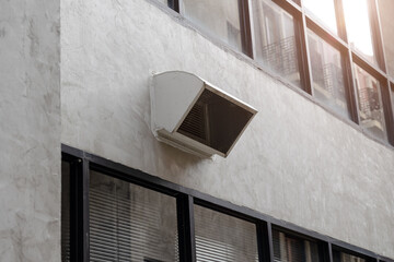 office building air ventilator pipe hole ventilates hot air from inside building to outside.