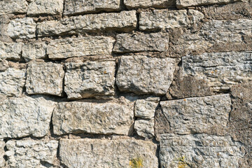 Structural masonry from natural stone of an old fortress wall.