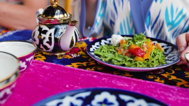 Shivit osh or Khorezm lagman green noodles Uzbek dish