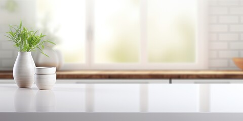 Fototapeta premium Blurred white modern kitchen background with empty corner countertop or table.