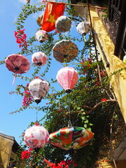 Fototapeta na wymiar Pink lanterns hanging on a string for decoration. In Hoi an Old Town in Vietnam. 