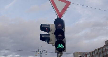 Urban Green Traffic Light: Eco-Friendly Cityscape with Bicycle Icon. Sustainable and environmentally conscious commuting. Green traffic light serves as a symbol urban life, sustainable practices.