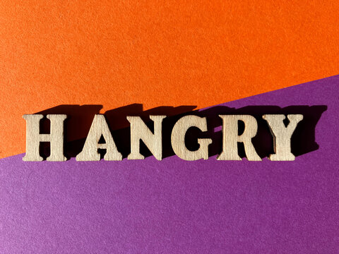 Hangry, a portmanteau  or blended word mader from angry and hungry.