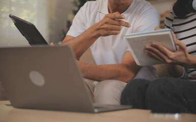 Asian business people discussing team of young asian entrepreneurs discussing business, Asia business team meeting discussion talking.