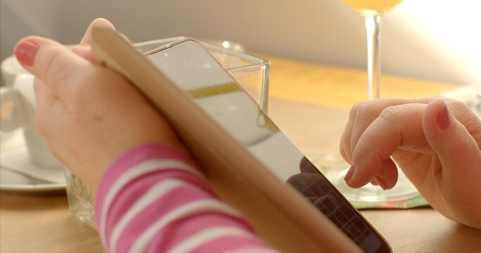 Electronic menu in a restaurant. Close-up ordering dishes through a mobile application refers to the use of technology to streamline dining experience. Innovative approach in digital smartphones era.