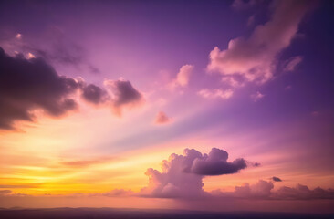 Naklejka premium Hidden setting sun of bright warm color behind the clouds and a lilac sky over the plain.