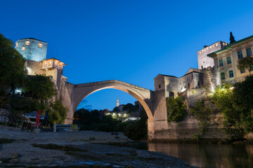 Fototapeta na wymiar Old bridge in Mostar on the river Neretva at dawn, quiet morning