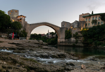 Fototapeta na wymiar Old bridge in Mostar on the river Neretva at dawn, quiet morning