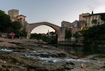 Papier Peint photo Stari Most Old bridge in Mostar on the river Neretva at dawn, quiet morning