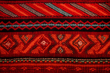 A sample of woven ethnic cloth fabric close up