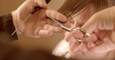 Close-Up Haircut: Sharp Scissors Trim Hair Strands. Artistry of hairstyling with sharp scissors meticulously trimming hair strands. Skilled stylist as they craft clean lines and perfect cuts. 