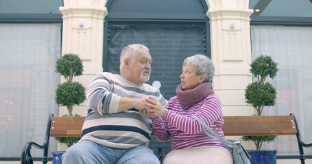 Couples conversation: Mature Adults Couple Conversing with Relationship Dynamics. Senior man and woman indoor portrait. Empathetic communication between two individuals. Seniors life. 