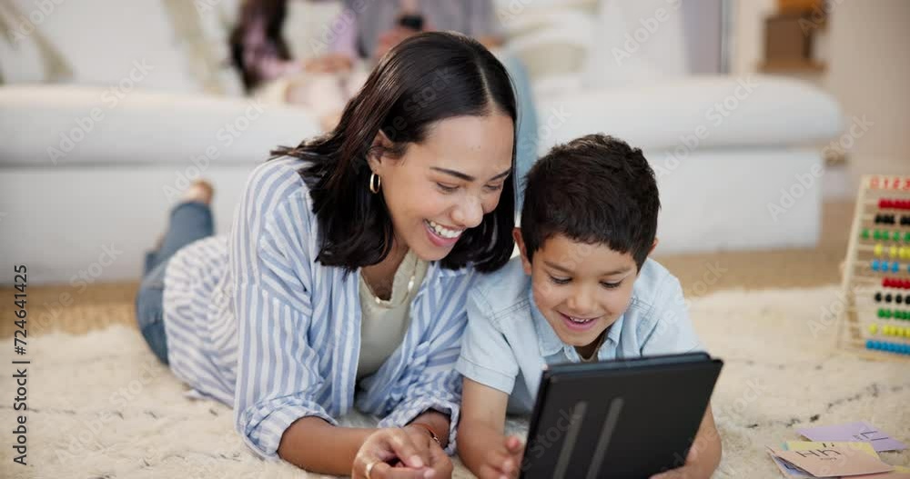 Wall mural Education, tablet and mother teaching son on floor of living room in home together for child development. Love, smile or happy with parent and boy in apartment to study or complete school homework